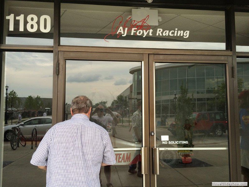 Some oaf peeking into A.J. Foyt Racing the night before the 500 - photo by Blair Riddle