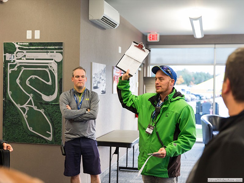 Morning briefing in front of the Driver Development Track map